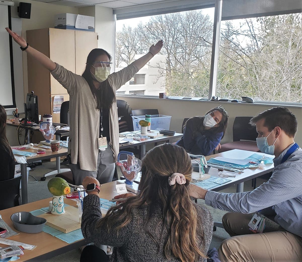 Dr. Amanda Kim demonstrating IUD placement to first-year residents