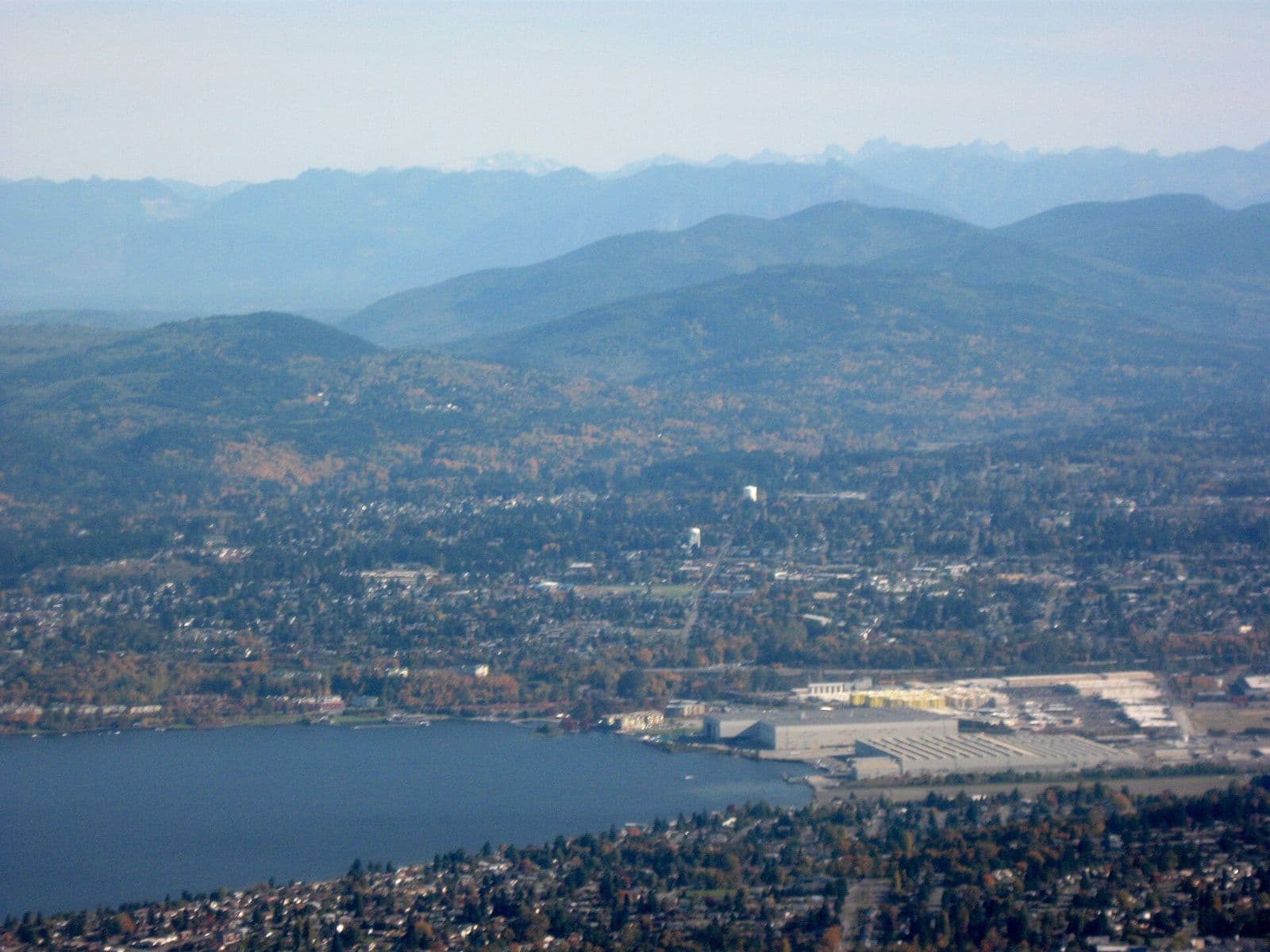 The south end of Lake Washington from above, with Renton and the Cascade foothills behind